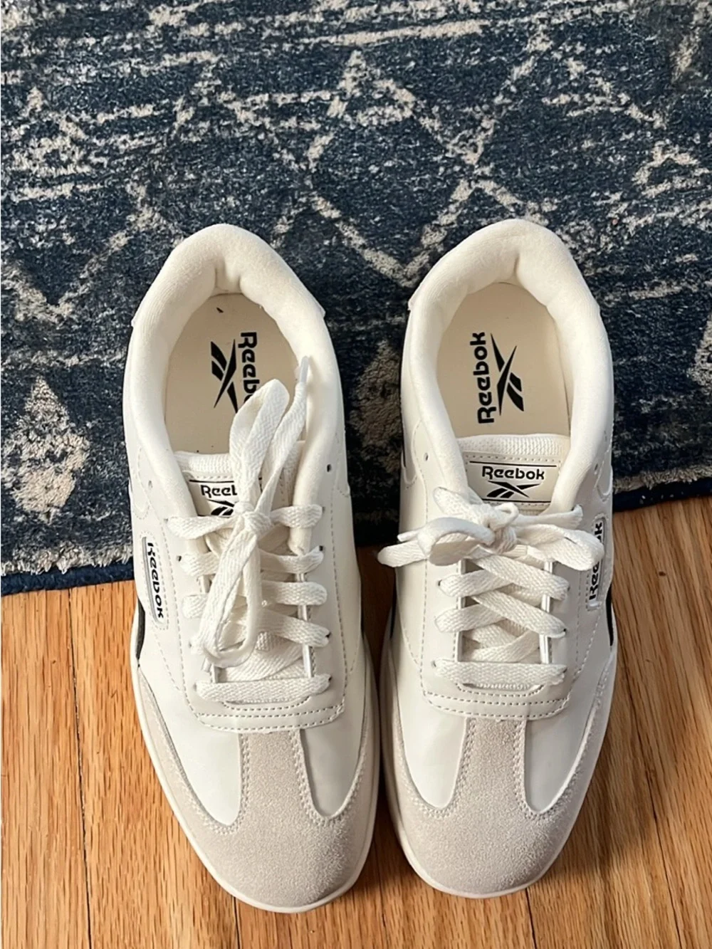 Reebok Cream and Black Low-Top Sneakers